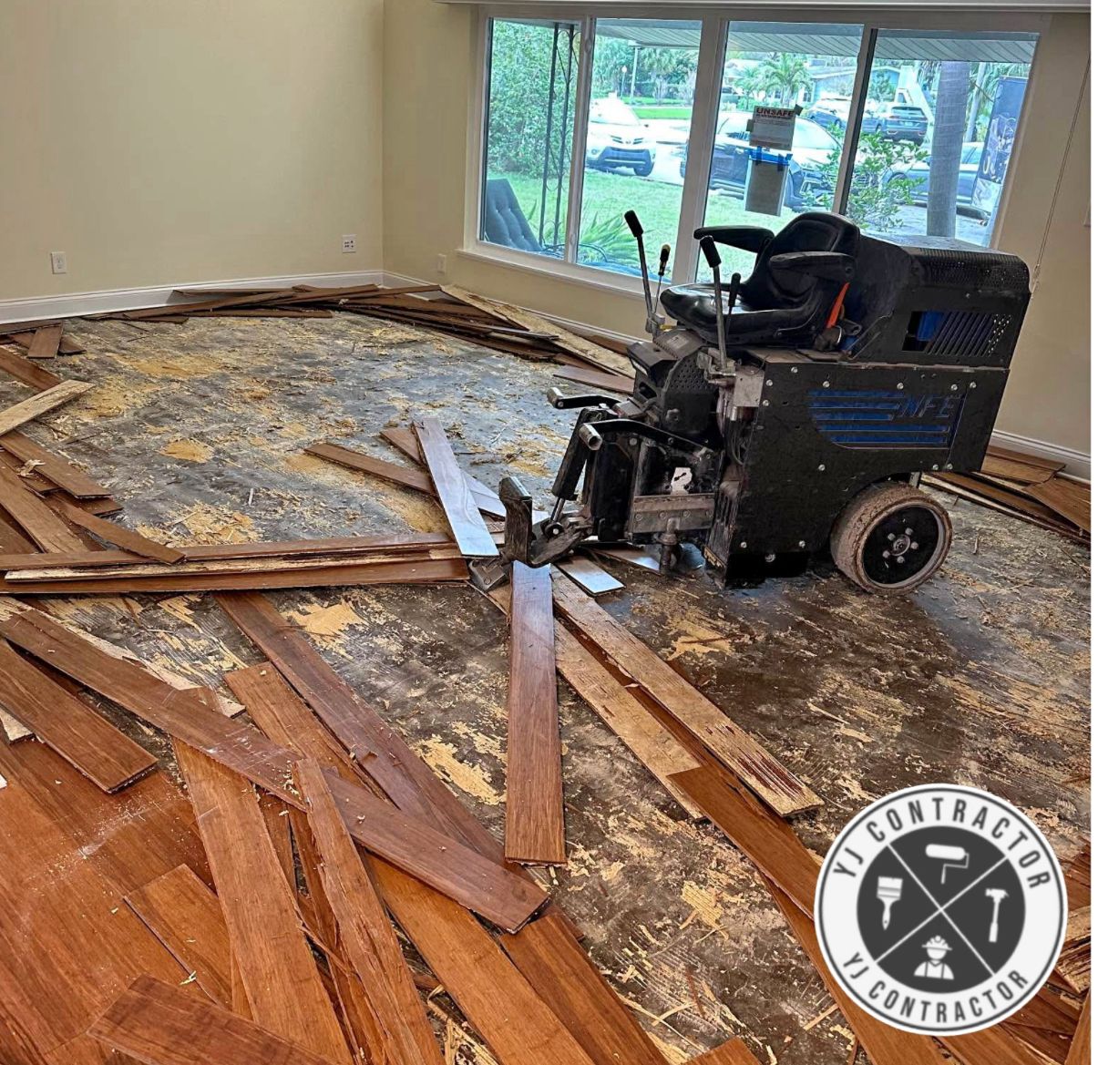 Wood flooring removal in progress using floor stripping equipment