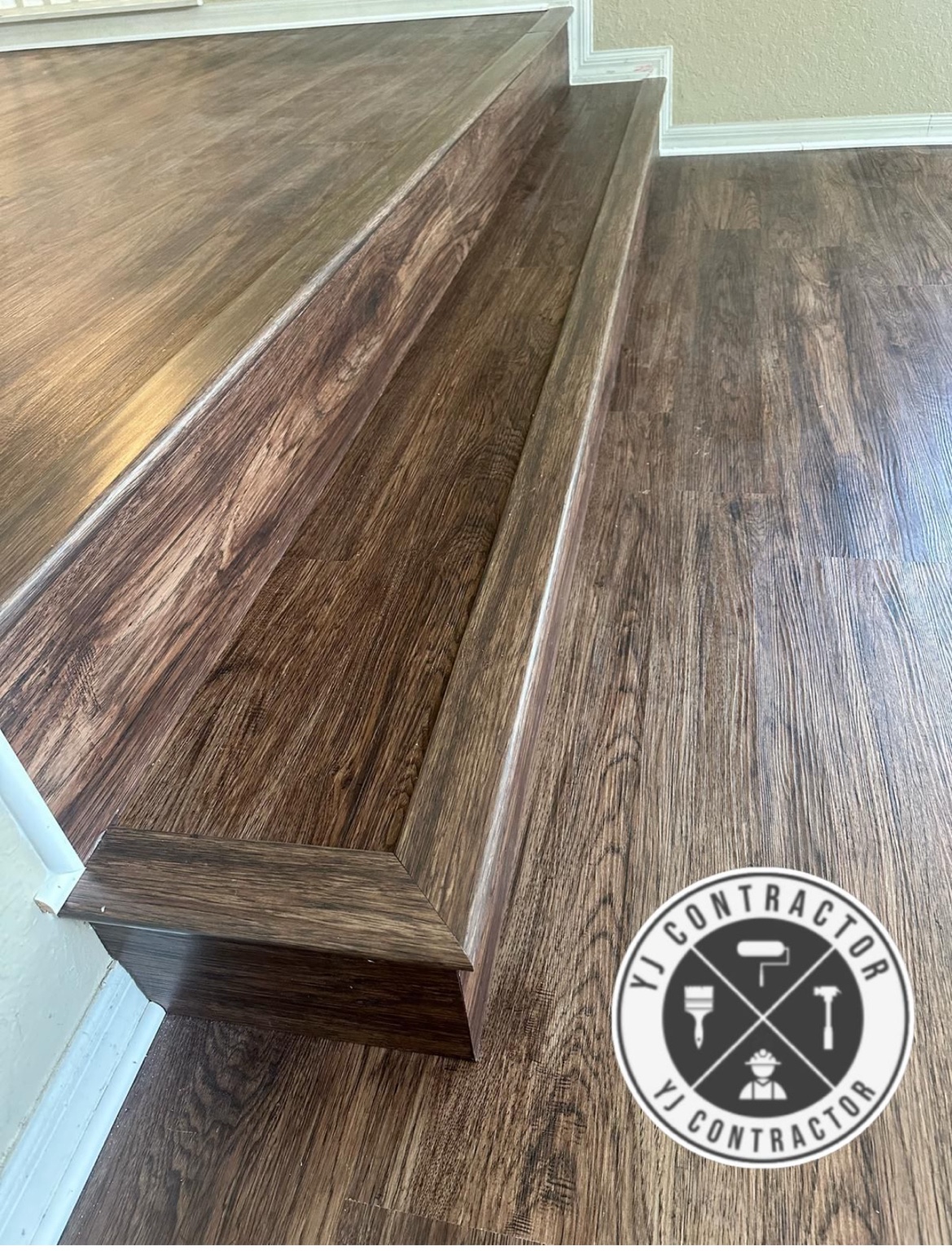 Wood-look flooring along stairs and landing