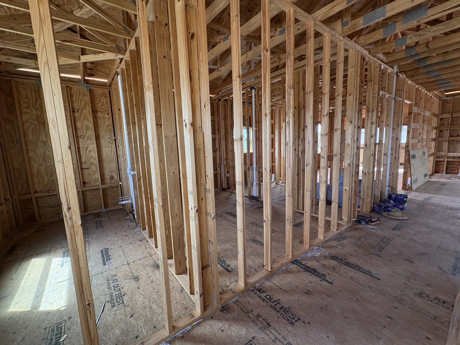 Wood stud walls and ceiling framing in progress