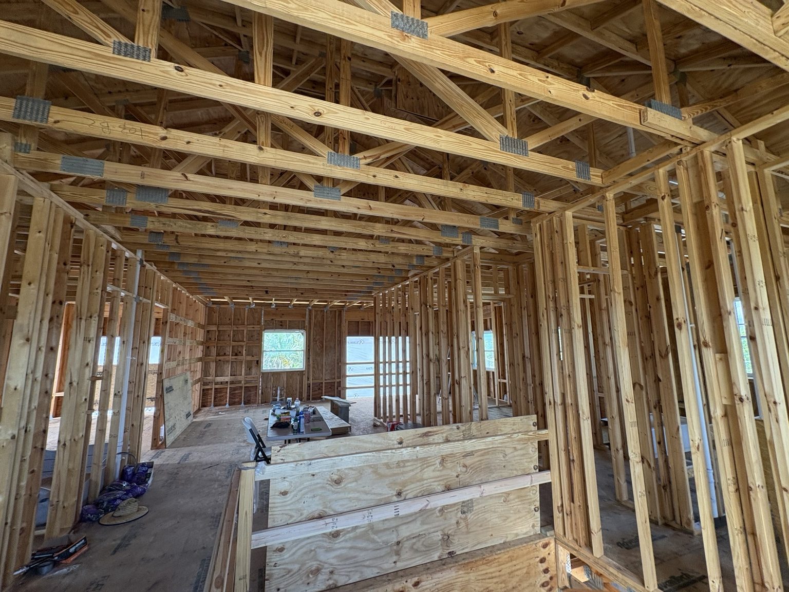 Wide view of wood stud walls and ceiling framing
