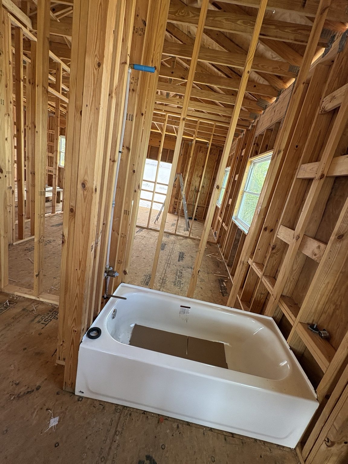 Wood stud framing around a bathroom