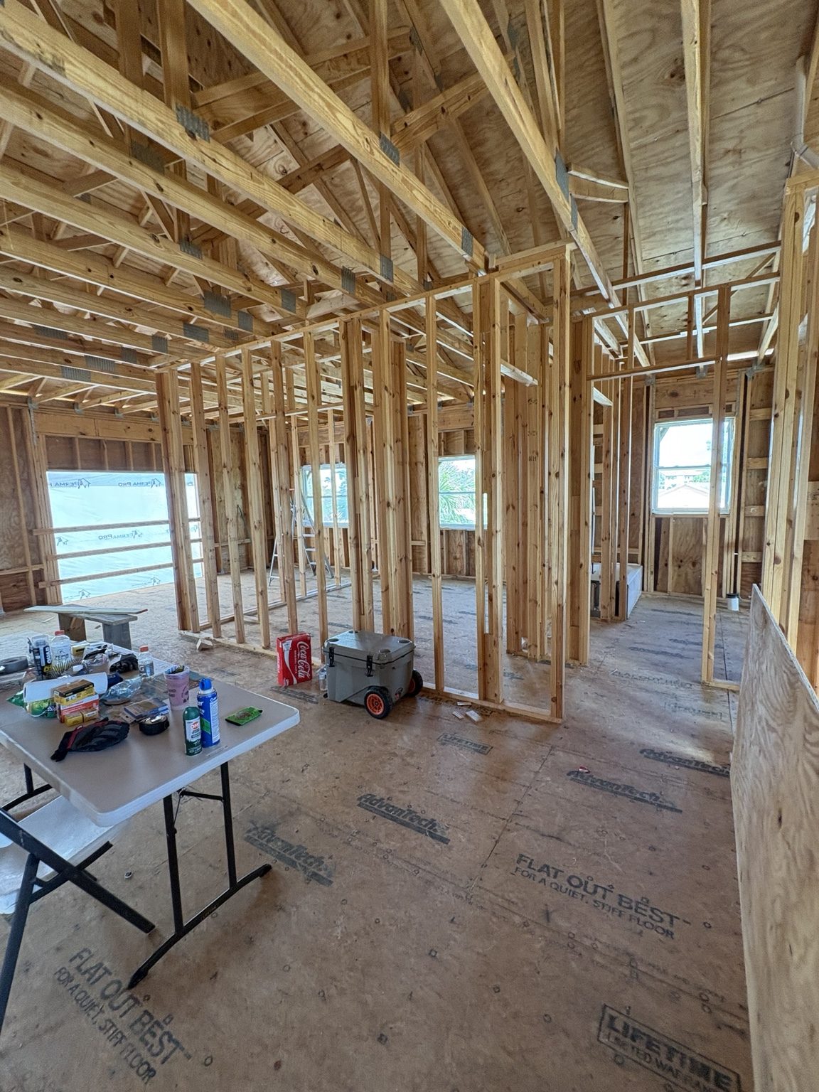 Open interior with wood framing in progress
