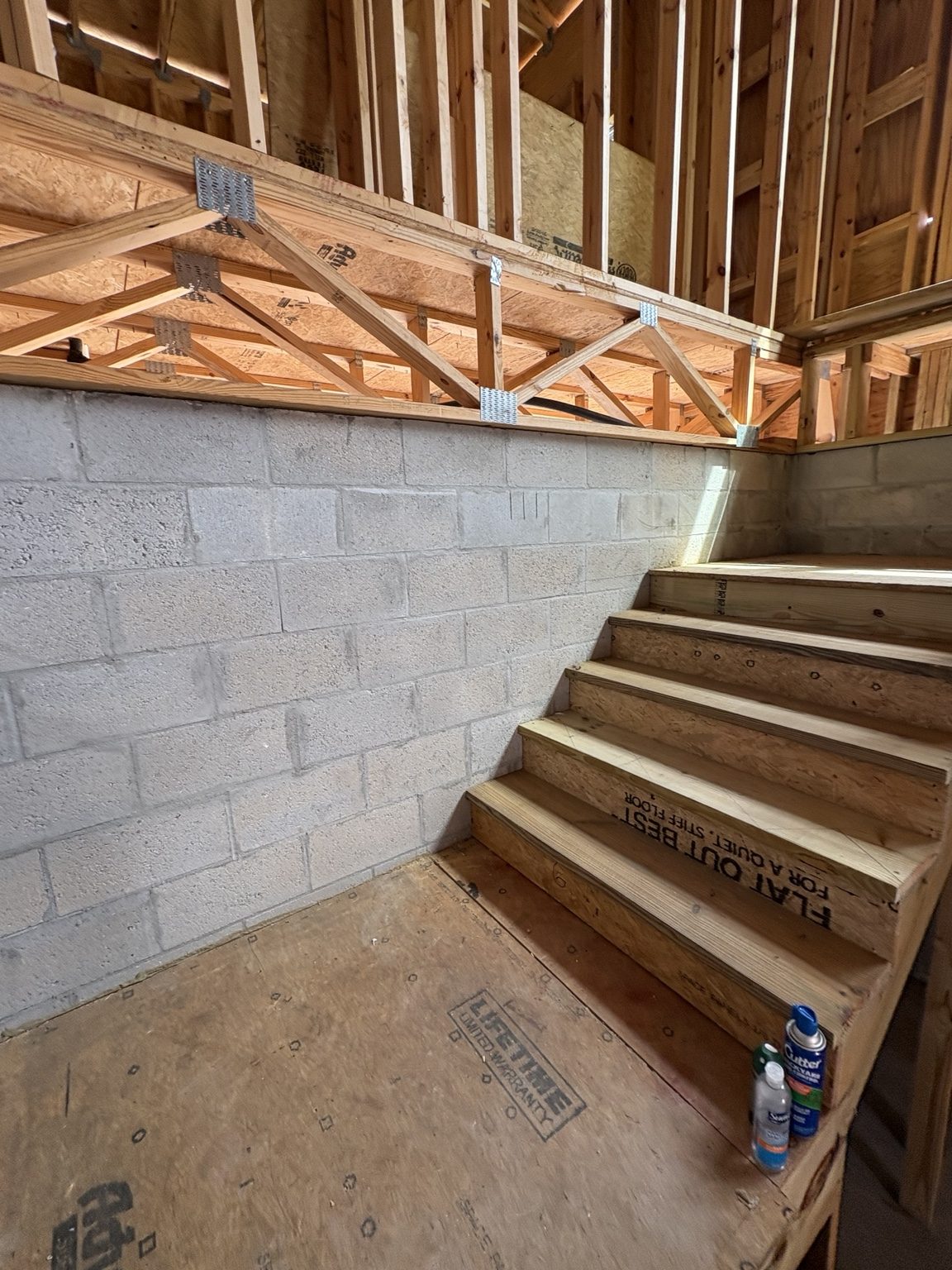 Wood stair framing and adjacent wall framing