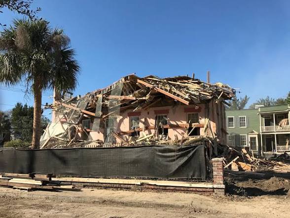 Building partially demolished during a complete demolition project