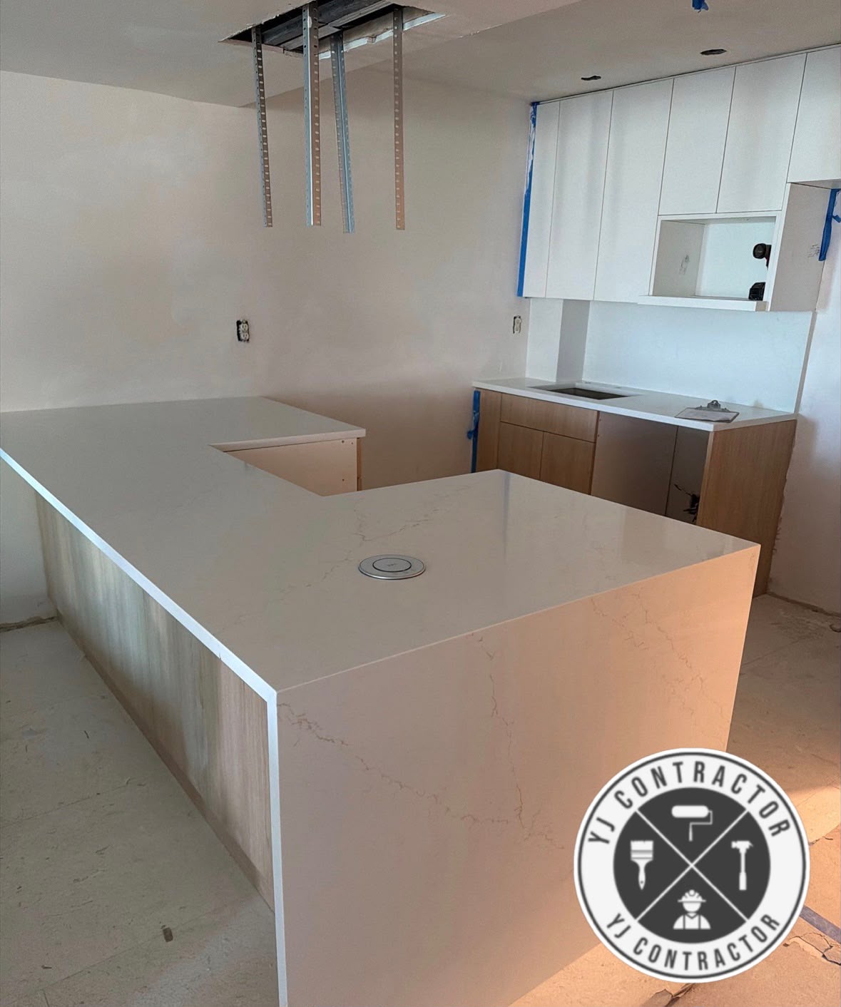 White kitchen countertop and custom cabinets during remodeling